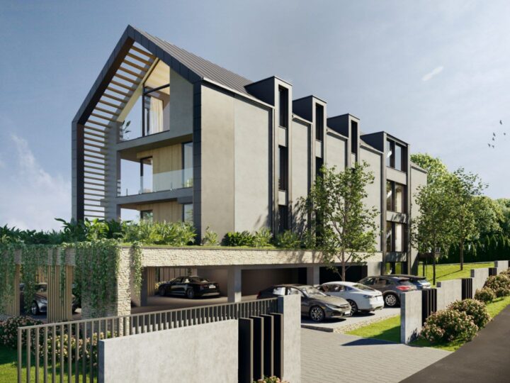 Az apartmanház utcai homlokzata a fedett parkolóval